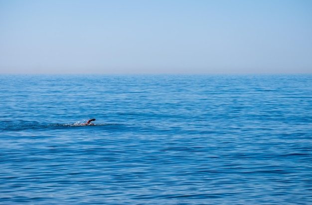 Senior man swimming in the see enjoying active retirement