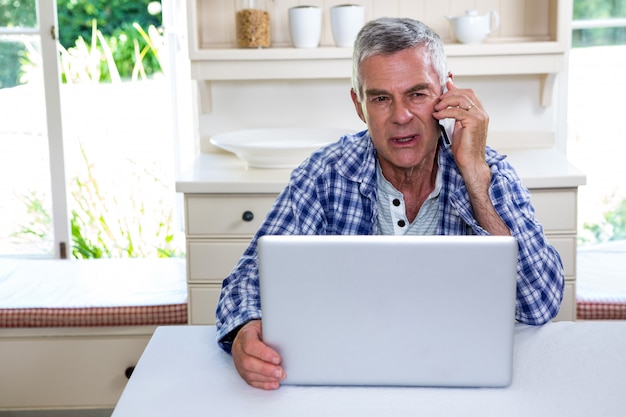 Senior man talking on mobile phone