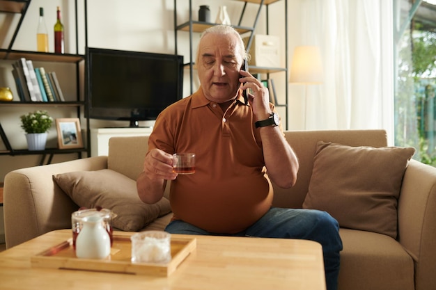 Senior Man Talking on Phone with Friend