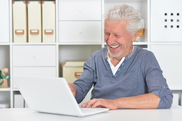 Senior man using laptop