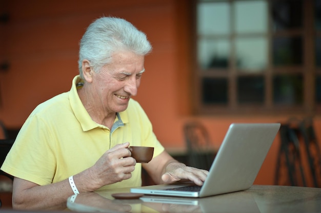 Senior man using laptop