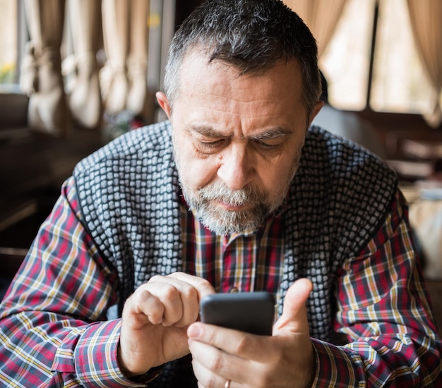 Senior man with smart phone