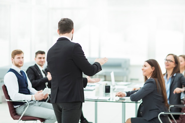 senior Manager of the company holds a working meeting with business team in modern office.