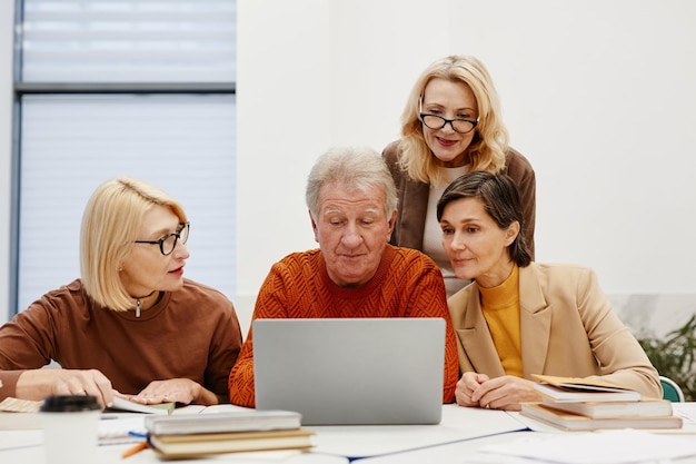 Senior people learnng to use laptop