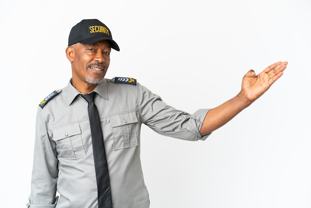 Senior staff man isolated on white wall extending hands to the side for inviting to come