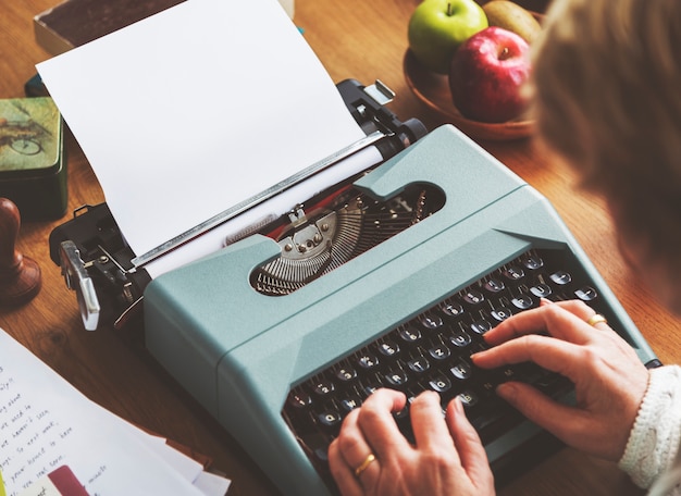 Senior typing on a typewriter