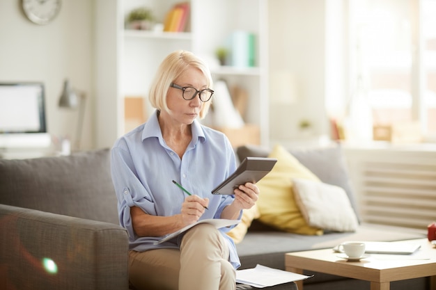 Senior Woman Calculating Budget