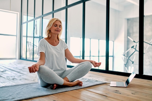 Senior woman doing sport at home