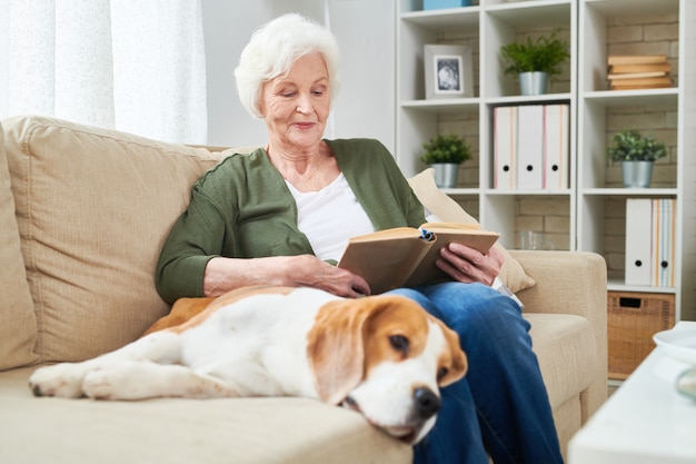 Senior woman and her dog at home