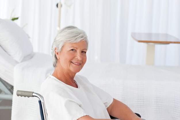 Senior woman in her wheelchair looking at the camera