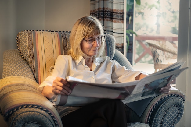 Senior woman reading a newspaper