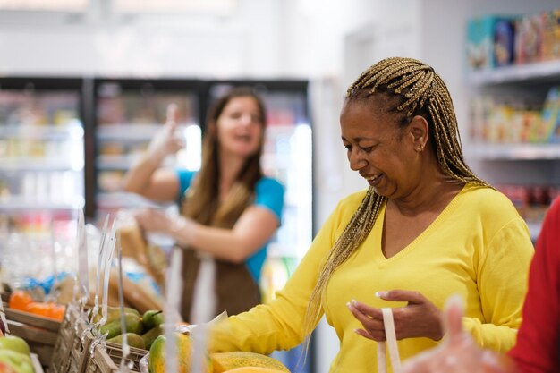 Senior woman selecting healthy food in market