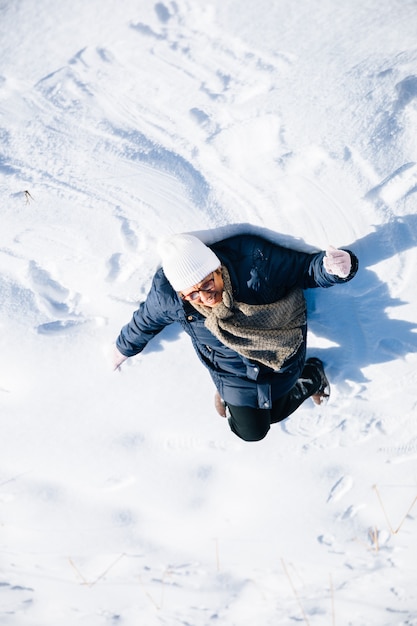 Senior woman in the snow