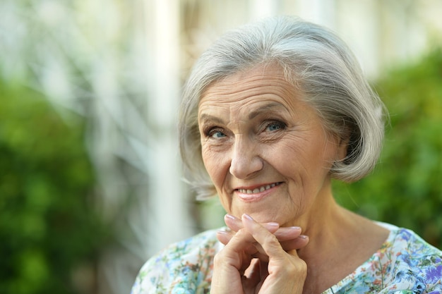 Senior woman in summer park