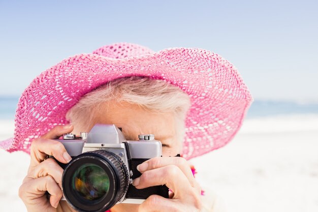 Senior woman taking picture