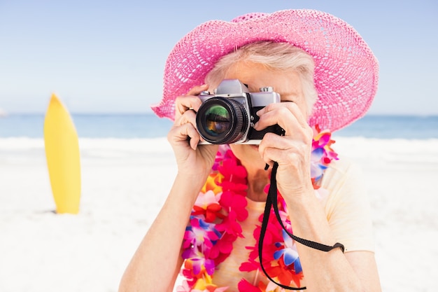 Senior woman taking picture