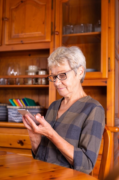 Senior woman using phone making video call