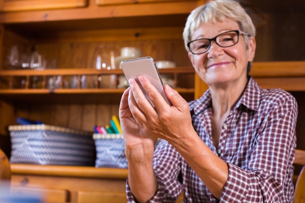 Senior woman using phone making video call