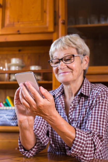 Senior woman using phone making video call