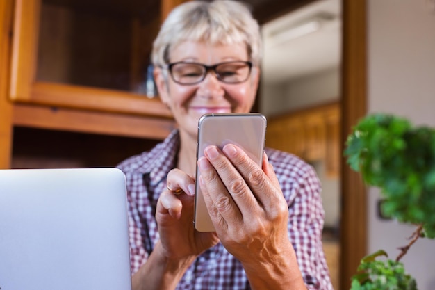 Senior woman using phone making video call