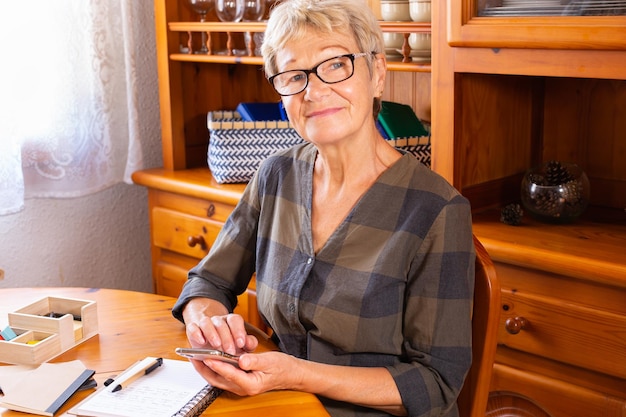 Senior woman using phone making video call