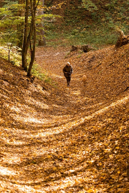 Senior woman with dog on a walk