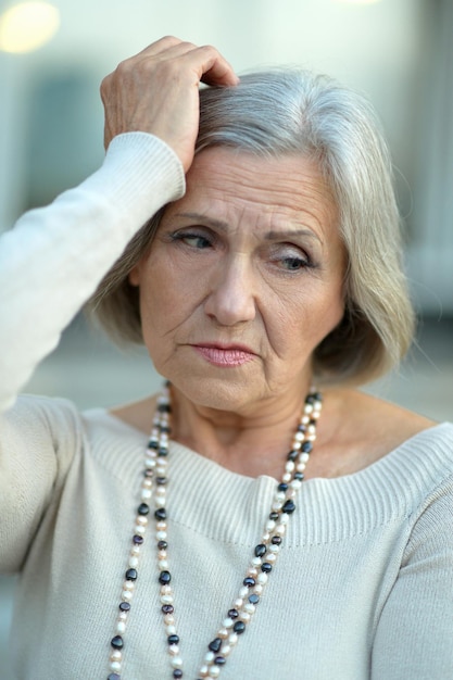 Senior woman with headache