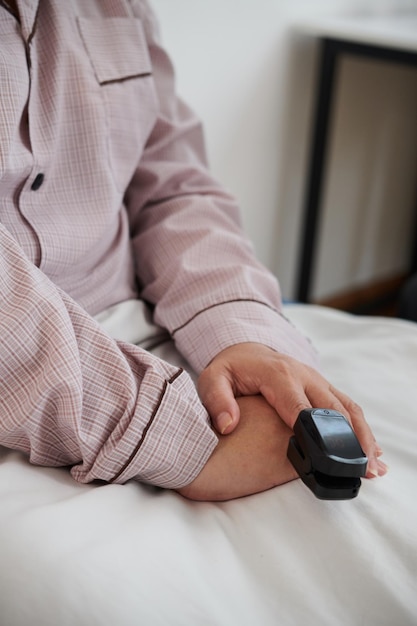 Senior Woman with Oximeter on Finger