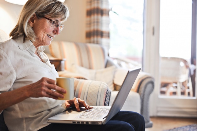 Senior woman working on a laptop