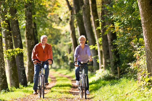 Seniors exercising with bicycle