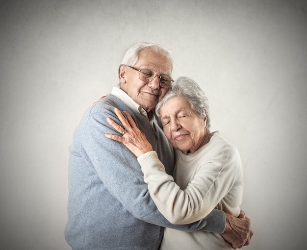 seniors hugging