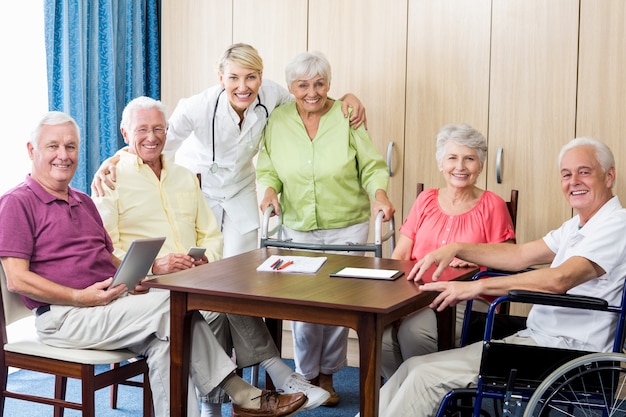 Seniors with wheelchair and walking aid