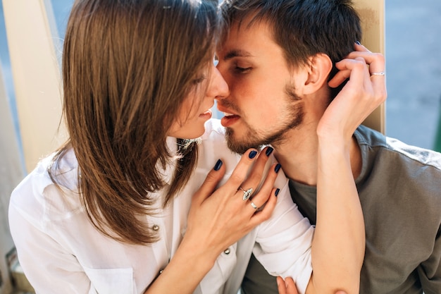 Sensual couple in love summer closeup portrait outdoor kissing and embracing