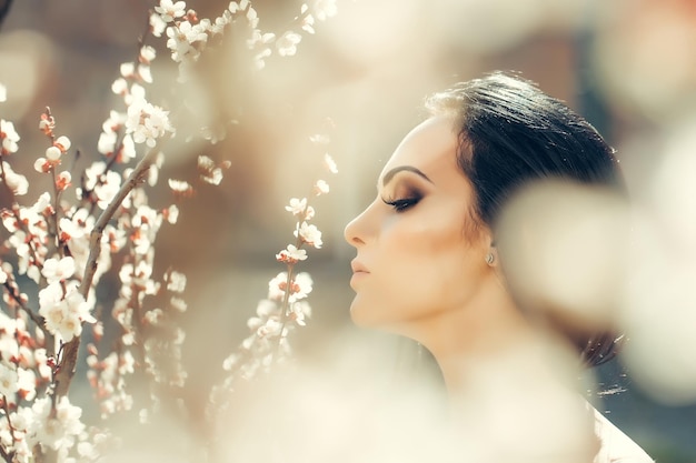 Sensual girl with blooming flowers