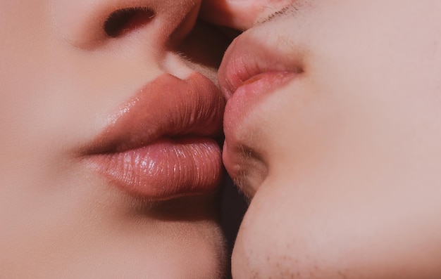 Sensual kiss close up Closeup two lips kissing sensual intimate young man woman kiss