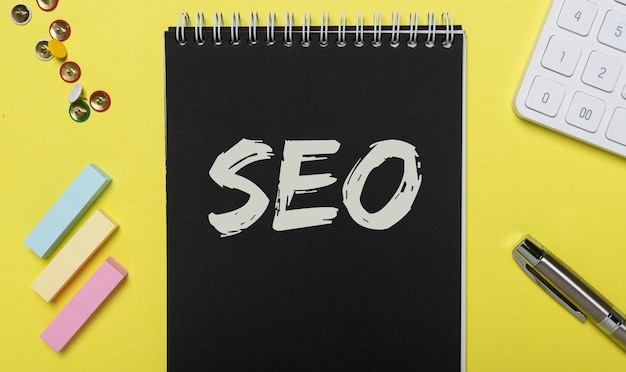 SEO acronym inscription on black and yellow background. Digital marketing.