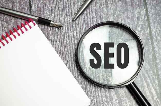 SEO word acronym through magnifier Business concept