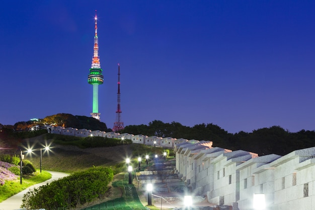 Seoul tower at night view and old wall with light, south korea.