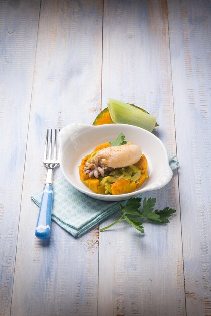 Sepia with steamed pumpkins and leek salad