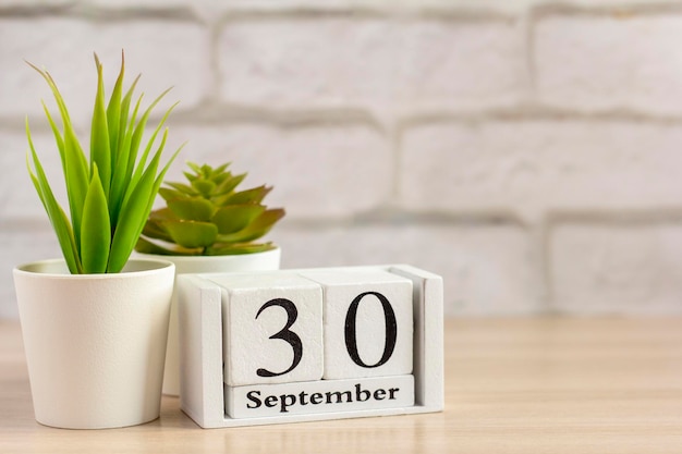 September 30 on a wooden calendar on a table or shelfOne day of the autumn monthCalendar for September Autumn