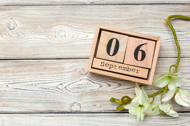 September 6. Image of September 6 wooden calendar on wooden table . Autumn day