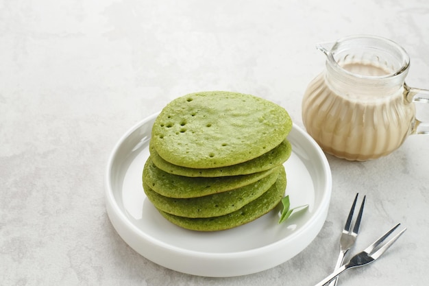 Serabi or Surabi, Indonesian pancake made of flour, rice flour, coconut milk. Served with palm sugar