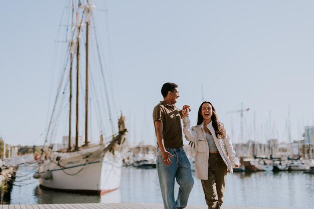 Serene stroll along Barcelona marina at with vintage sailing vessel