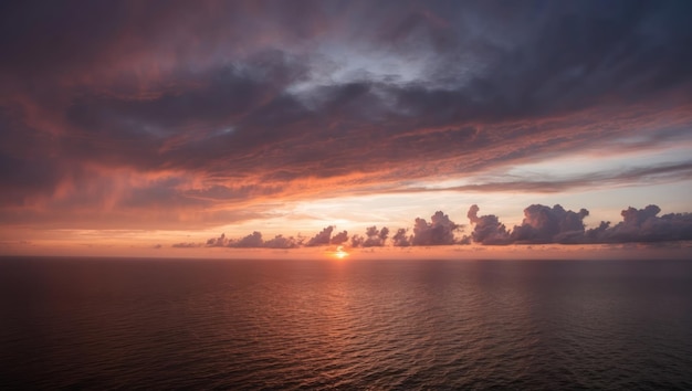 Photo a serene sunset over the ocean with colorful clouds and calm waters