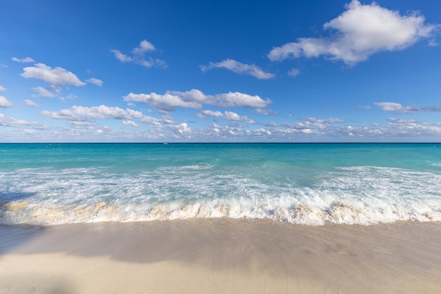 Serene turquoise Isla Mujeres beach Playa Norte with emerald waters sandy seashore and beach bars