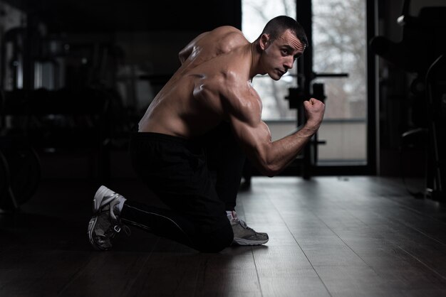 Serious Bodybuilder Standing In The Gym