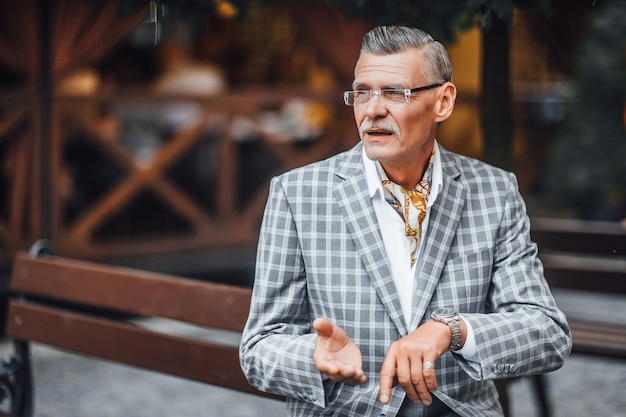 Serious business man in a fashionable stylish checkered suit