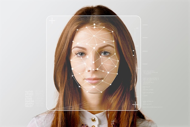 Serious business woman and smart technology for face recognition, double exposure.