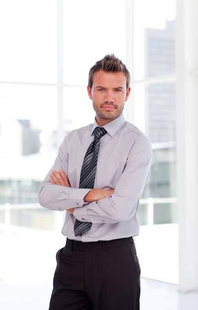 Serious businessman with folded arms