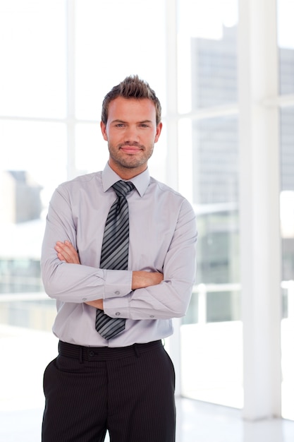 Serious businessman with folded arms